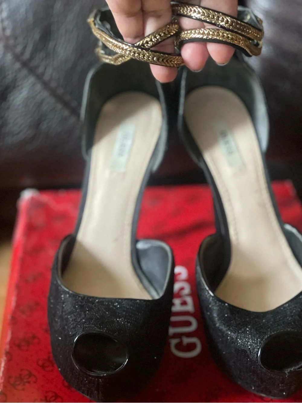 black peep-toe platform high heels by Guess featuring metallic gold double-wrap